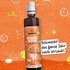 Illustration einer Orange Bitter Sirup Flasche von SONNENTOR und dem Text: "Schmeckt das ganze Jahr nach Urlaub" auf orangem Hintergrund.